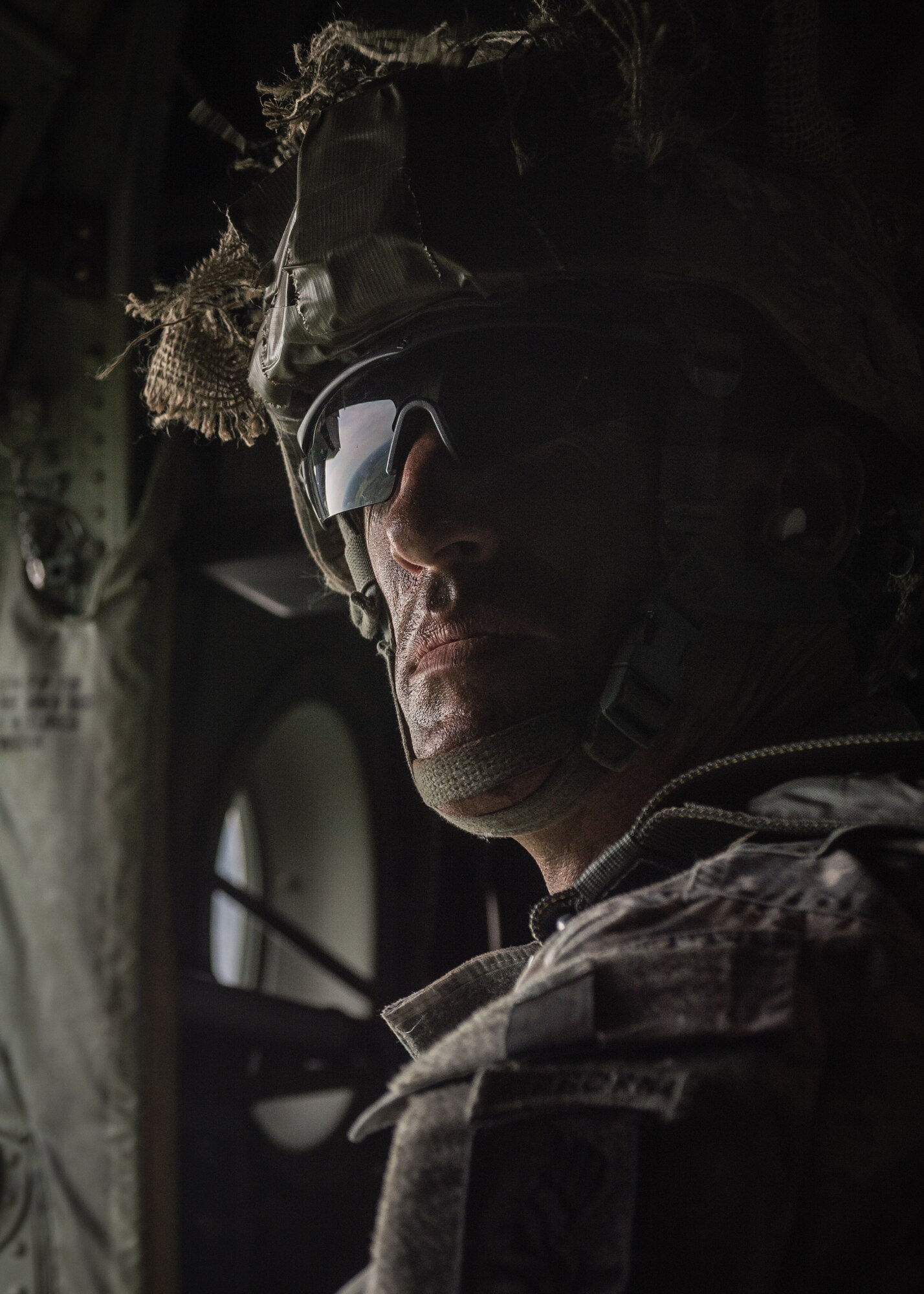 A U.S. Army paratrooper waits inside a 37th Airlift Squadron C-130J Super Hercules alongside American and Lithuanian paratroopers over Lithuania, May 17, 2014. Pilots and loadmasters from the 37th AS, alongside an 86th Aircraft Maintenance flying crew chief spent four days across three Baltic countries assisting in personnel drops of allied partners and American service members. (U.S. Air Force photo/Airman 1st Class Jordan Castelan)