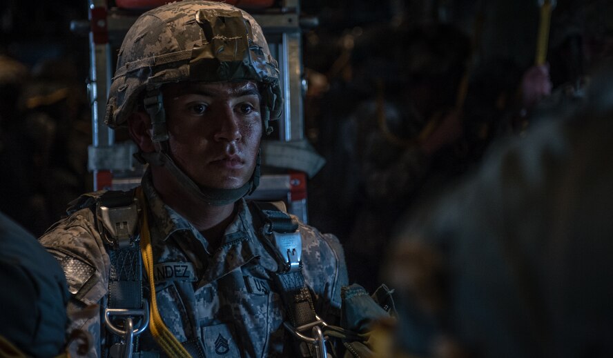 A U.S. Army paratrooper waits inside a 37th Airlift Squadron C-130J Super Hercules alongside American and Lithuanian paratroopers over Lithuania, May 17, 2014. Pilots and loadmasters from the 37th AS, alongside an 86th Aircraft Maintenance flying crew chief spent four days across three Baltic countries assisting in personnel drops of allied partners and American service members. (U.S. Air Force photo/Airman 1st Class Jordan Castelan)