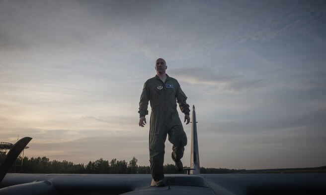 Tech. Sgt. Francis Gilson, 86th Aircraft Maintenance Squadron flying crew chief, an Andersonville, Tennesse native, prepares to climb inside a 37th Airlift Squadron C-130J Super Hercules after post-flight checks on Riga International Airport, Latvia, May 17, 2014. Gilson was part of a five-man crew including 37th AS pilots and loadmasters. The team spent four days across three Baltic countries assisting in personnel drops of allied partners and American service members. (U.S. Air Force photo/Airman 1st Class Jordan Castelan)