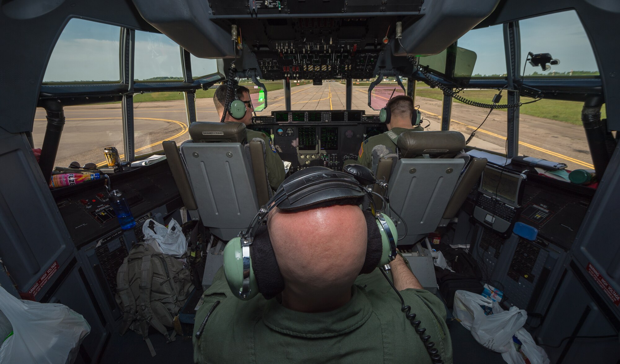 Tech. Sgt. Francis Gilson, 86th Aircraft Maintenance Squadron flying crew chief, an Andersonville, Tennesse native, waits to take off from Šiauliai International Airport, Lithuania to airlift American service members and Lithuanian paratroopers on a 37th Airlift Squadron C-130J Super Hercules, May 17, 2014. Gilson was part of a five-man crew including 37th AS pilots and loadmasters. The team spent four days across three Baltic countries assisting in personnel drops of allied partners and American service members. (U.S. Air Force photo/Airman 1st Class Jordan Castelan)