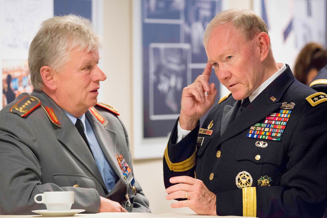 U.S. Army Gen. Martin E. Dempsey, right, chairman of the Joint Chiefs of Staff, speaks with German army Gen. Volker Wieker, chief of staff of the German Armed Forces, during a break from the NATO Chiefs of Defense meetings in Brussels, May 21, 2014. The alliance of 28-member countries discussed current military issues including the way ahead in Afghanistan, Ukraine and future threats. DOD photo by Army Staff Sgt. Sean K. Harp