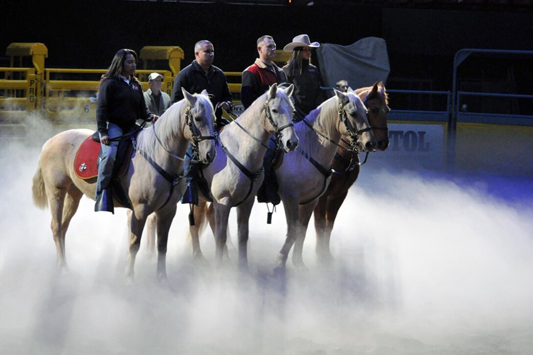 The U.S. Marine Corps Mounted Color Guard rehearses for the 2012 National Finals Rodeo at the Thomas Mac Center in Las Vegas, Dec. 11, 2012. 
