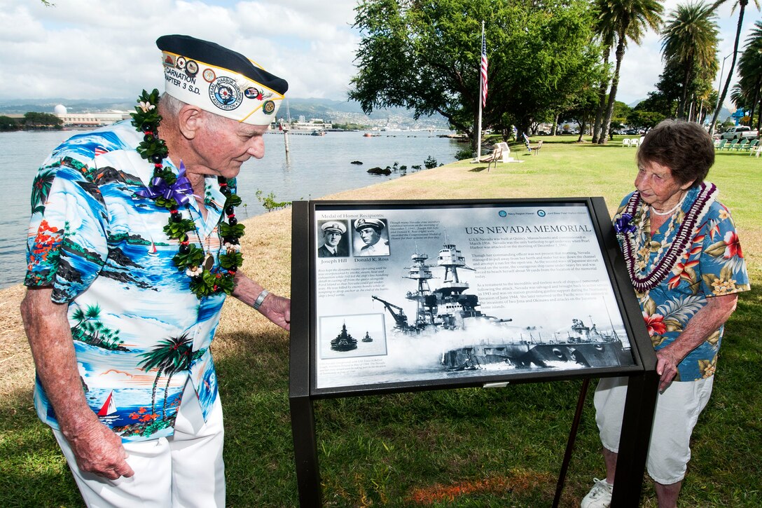 Woodrow Derby, who served aboard the former battleship the USS Nevada, left, and his wife, Christine, visit the new the USS Nevada wayside exhibit at Hospital Point at Joint Base Pearl Harbor-Hickam, Hawaii, Dec. 6, 2012. The Nevada was the only battleship able to get underway during the Dec. 7, 1941, attack.  
