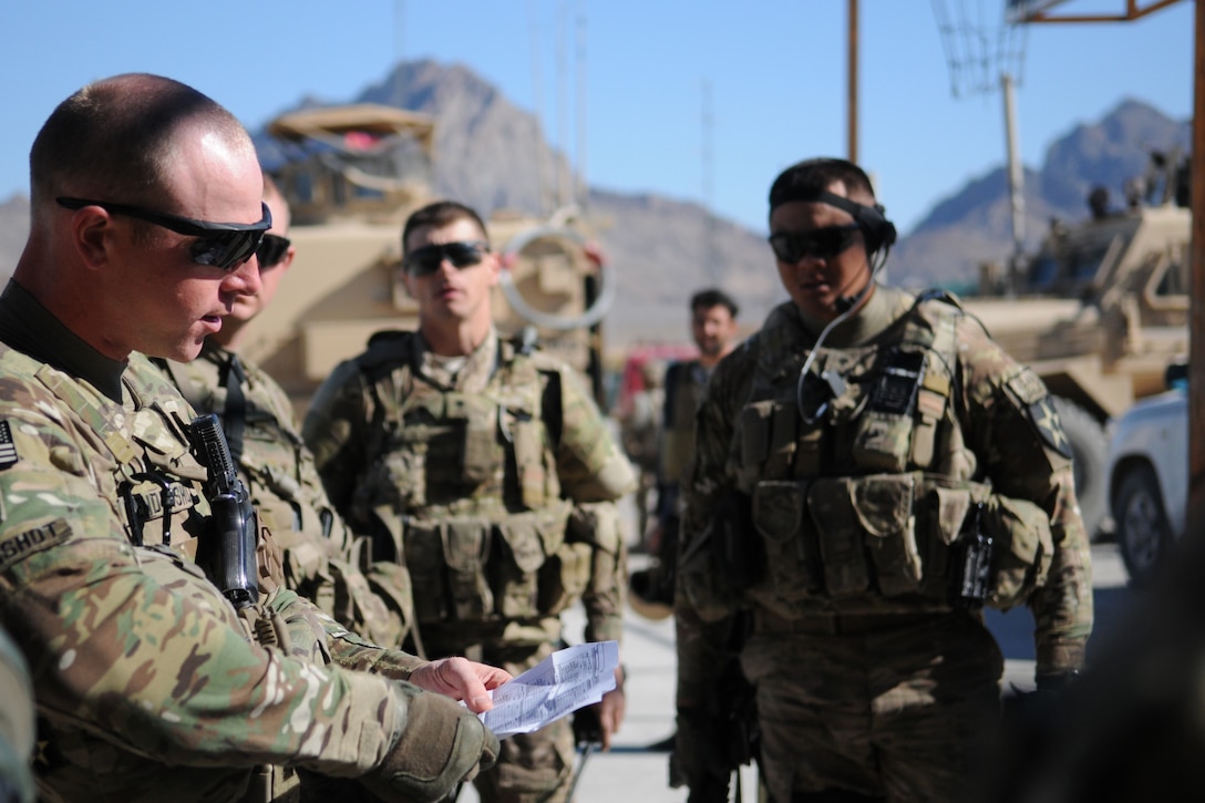 U.S. Army Sgt. Thaddaeus Hendershot, left, conducts a pre-mission brief at Forward Operating Base Farah before departing to meet with the chief justice of Farah province in Farah City, Afghanistan, Nov. 29, 2012.  
