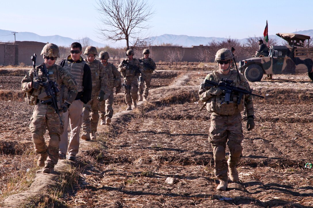 U.S. soldiers conduct a patrol during a combat operation in Kotub Khel, near Combat Outpost McClain in eastern Afghanistan's Logar province, Nov. 26, 2012. The soldiers are assigned to the 1st Squadron, 91st Calvary Regiment, 173rd Airborne Brigade Combat Team.  
