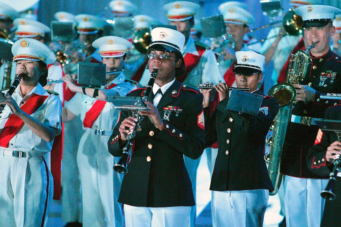 U.S. Marines play side by side with Japan Self-Defense Force bands during the 2012 Japan Self-Defense Force Marching Festival at the Nippon Budokan Arena in Tokyo, Nov. 17, 2012. The Marines are assigned to the 3rd Marine Expeditionary Force Band.  
