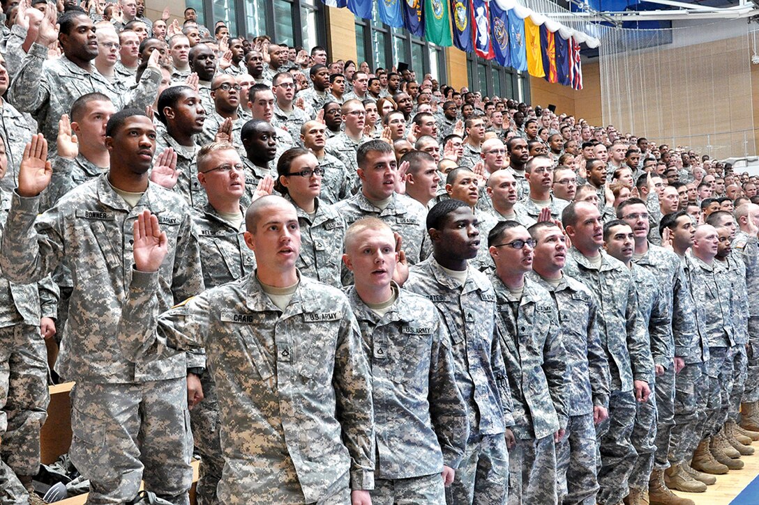 U.S. soldiers reaffirm their oath during the 5th Signal Command's Operation Solemn Promise commemoration event, Nov. 16, 2012, at the Wiesbaden Fitness Center, U.S. Army Garrison Wiesbaden, Germany.  

