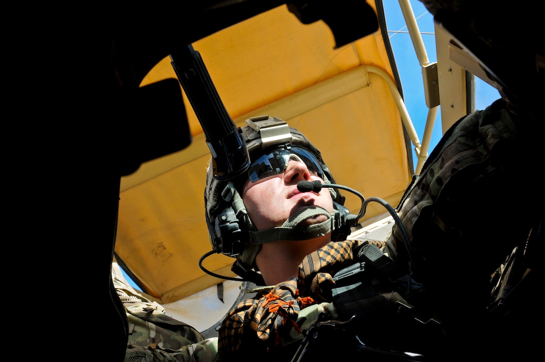 U.S. Army Spc. Eric Saum maintains a watchful eye during a convoy in the Pusht-e Rod district in Afghanistan's Farah province, Nov. 19, 2012. Saum is a gunner for Provincial Reconstruction Team Farah and on its security force. The team's mission is to train, advise and assist Afghan government leaders at the municipal, district and provincial levels in the province.  
