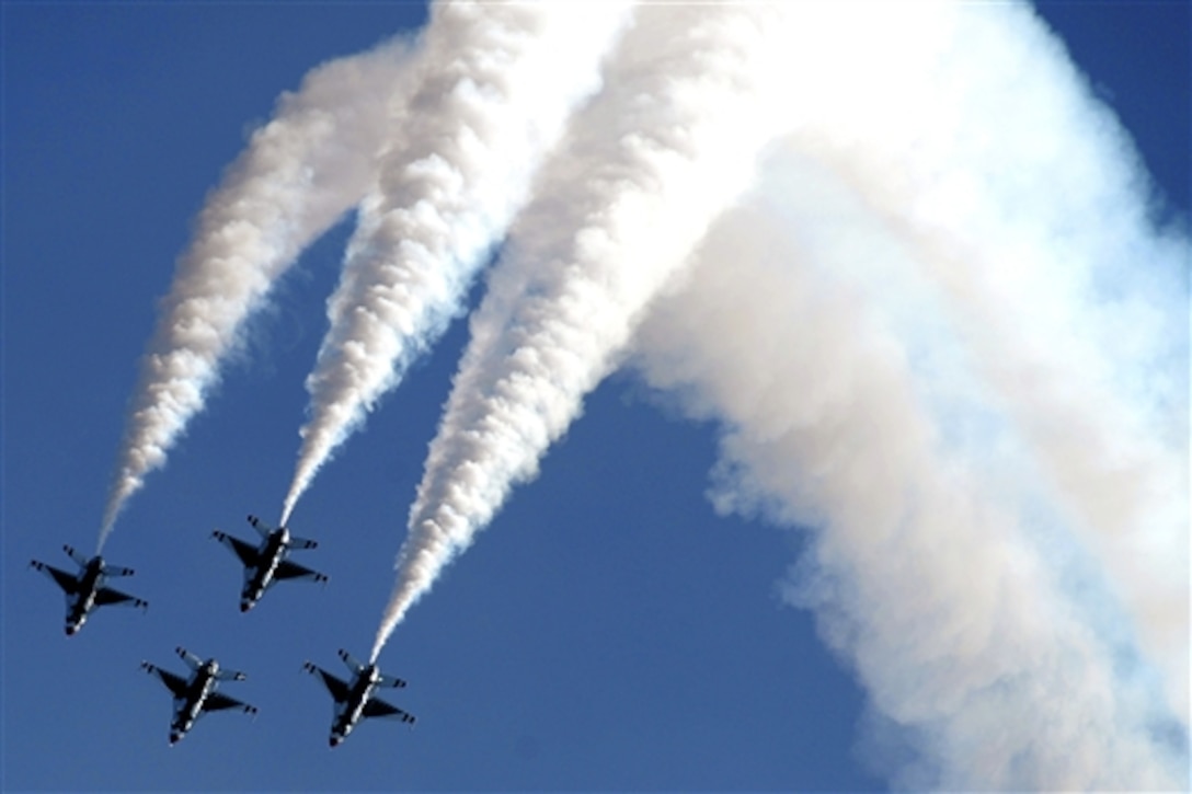 The U.S. Air Force Thunderbirds perform the diamond formation roll during open house on Joint Base McGuire-Dix-Lakehurst, N.J., May 10, 2014. 