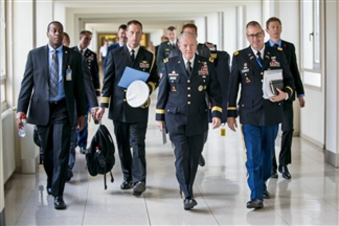 U.S. Army Gen. Martin E. Dempsey, chairman of the Joint Chiefs of Staff, walks to meet with military counterparts during NATO Chiefs of Defense meetings in Brussels, May 21, 2014. Dempsey discussed current military issues, including the situation in Eastern Europe, the way ahead in Afghanistan and Ukraine, and future threats.
