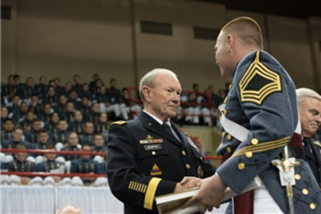 Army Gen. Martin E. Dempsey, chairman of the Joint Chiefs of Staff, congratulates a graduate of the Virginia Military Institute during the school’s commencement ceremony in Lexington, Va., May 16, 2014.