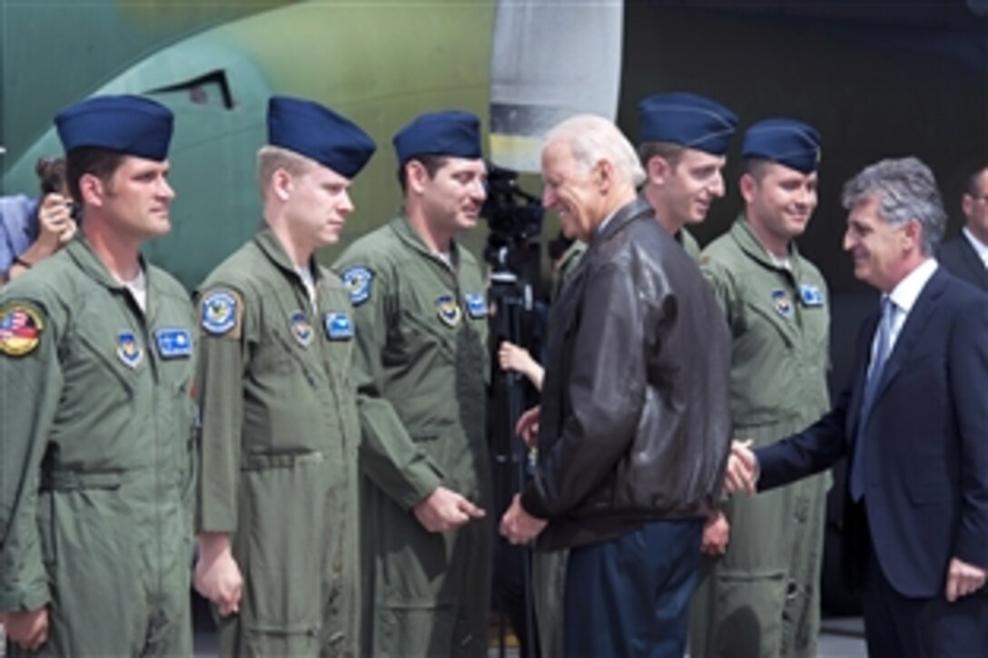 U.S. Vice President Joe Biden, center, meets U.S. airmen in Bucharest, Romania, May 20, 2014. The airmen, assigned to the 37th Airlift and the 86th Aircraft Maintenance squadrons, visited Romania to take part in Carpathian Spring 2014, a training exercise that helps both countries maintain training proficiencies and build partnerships.