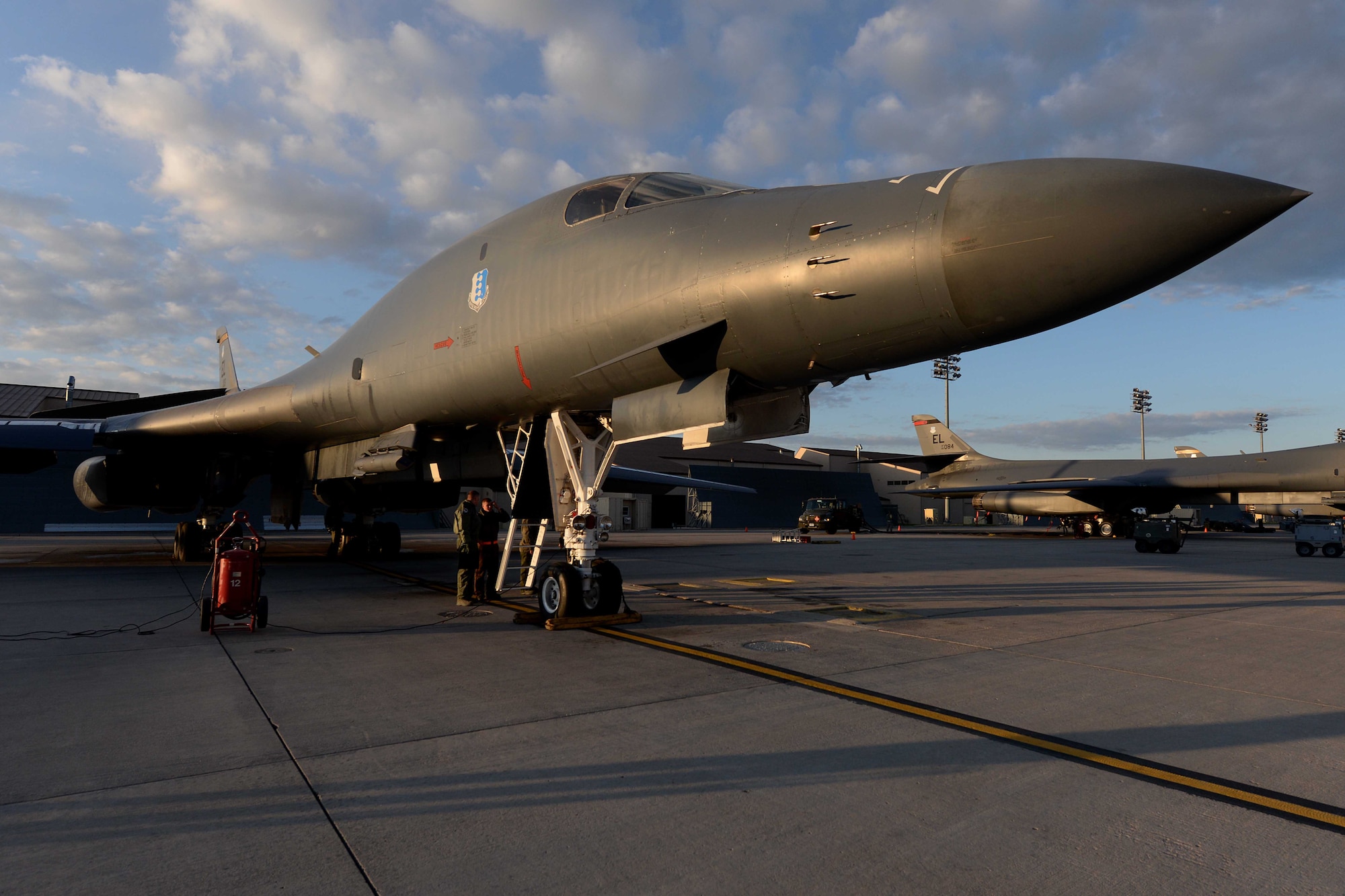 Aviators and maintainers perform final checks on a B-1B Lancer, May 12, 2014, on the flightline at Ellsworth Air Force Base, S.D. The 28th Bomb Wing generated two B-1s in support of a round trip, non-stop training mission from Ellsworth to employ munitions on a range near Guam, demonstrating the long-range, precision strike capabilities of the aircraft. (U.S. Air Force photo by Airman 1st Class Rebecca Imwalle)