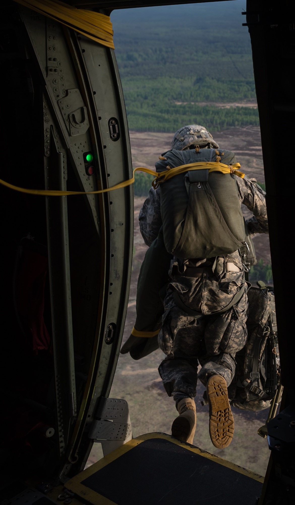 A U.S. Army paratrooper jumps from a 37th Airlift Squadron C-130J Super Hercules over Lithuania, May 17, 2014. Pilots and loadmasters from the 37th AS, alongside an 86th Aircraft Maintenance flying crew chief spent four days across three Baltic countries assisting in personnel drops of allied partners and American service members. (U.S. Air Force photo/Airman 1st Class Jordan Castelan)