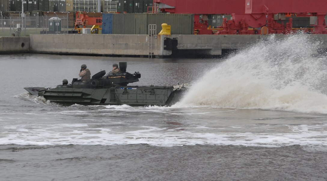 An assault amphibious vehicle churns up Marine Corps Support Facility Blount Island’s slipway of the St. John's River, Jacksonville, Fla., May 15, marking the first time in several years tracks have splashed from a Maritime Prepositioning Force ship.