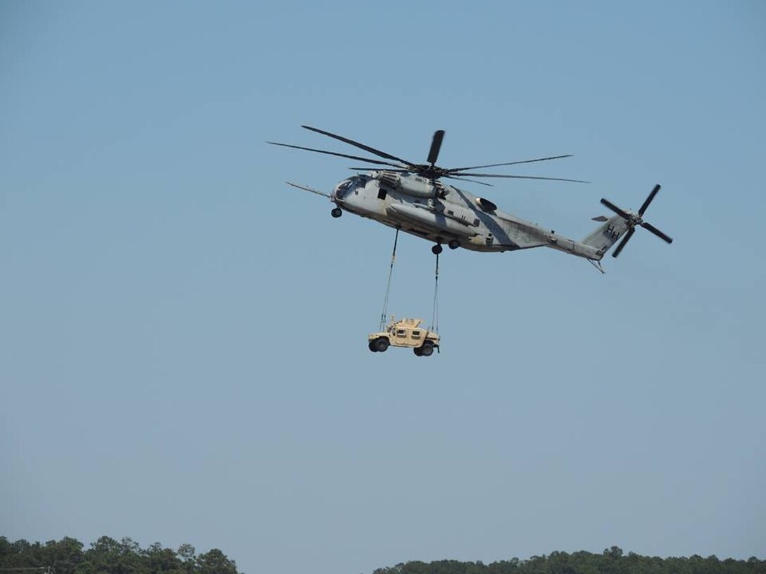 A CH-53E Super Stallion demonstrates its medium-lift capabilities during the Marine-Air Ground Task Force demonstration during the 2014 Marine Corps Air Station Cherry Point “Inspiration to Innovation” Air Show. The Super Stallion belongs to Marine Heavy Helicopter Squadron 366.