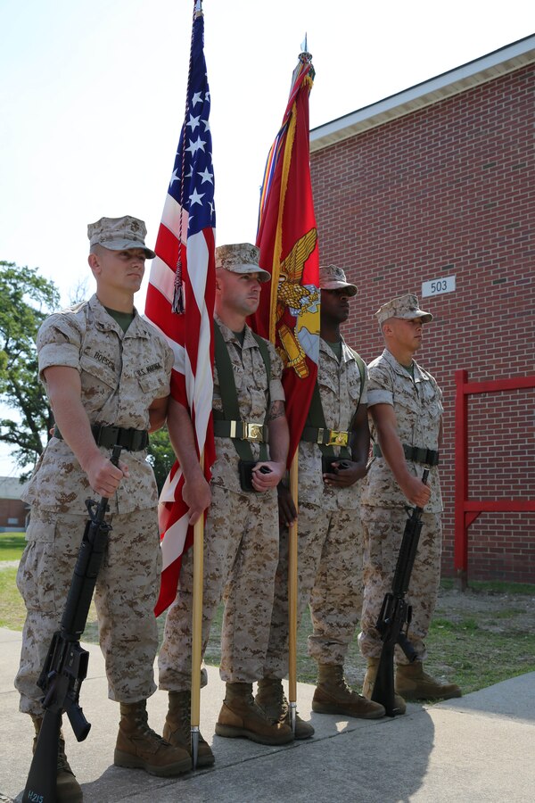 Marines in the color guard for 2nd Light Armored Reconnaissance Battalion, 2nd Marine Division, prepare to conduct the march on of the colors to begin a memorial service held at the battalion headquarters aboard Marine Corps Base Camp Lejeune, N.C., May 21, 2014. The service included the playing of the national anthem, the Marine’s prayer, playing of Amazing Grace, a three-shot volley and the playing of Taps.

