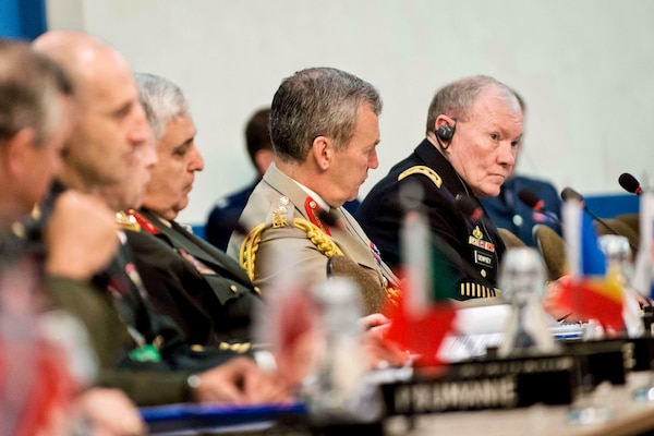 U.S. Army Gen. Martin E. Dempsey, right, chairman of the Joint Chiefs of Staff, at the NATO Chiefs of Defense meetings in Brussels, May 21, 2014. 