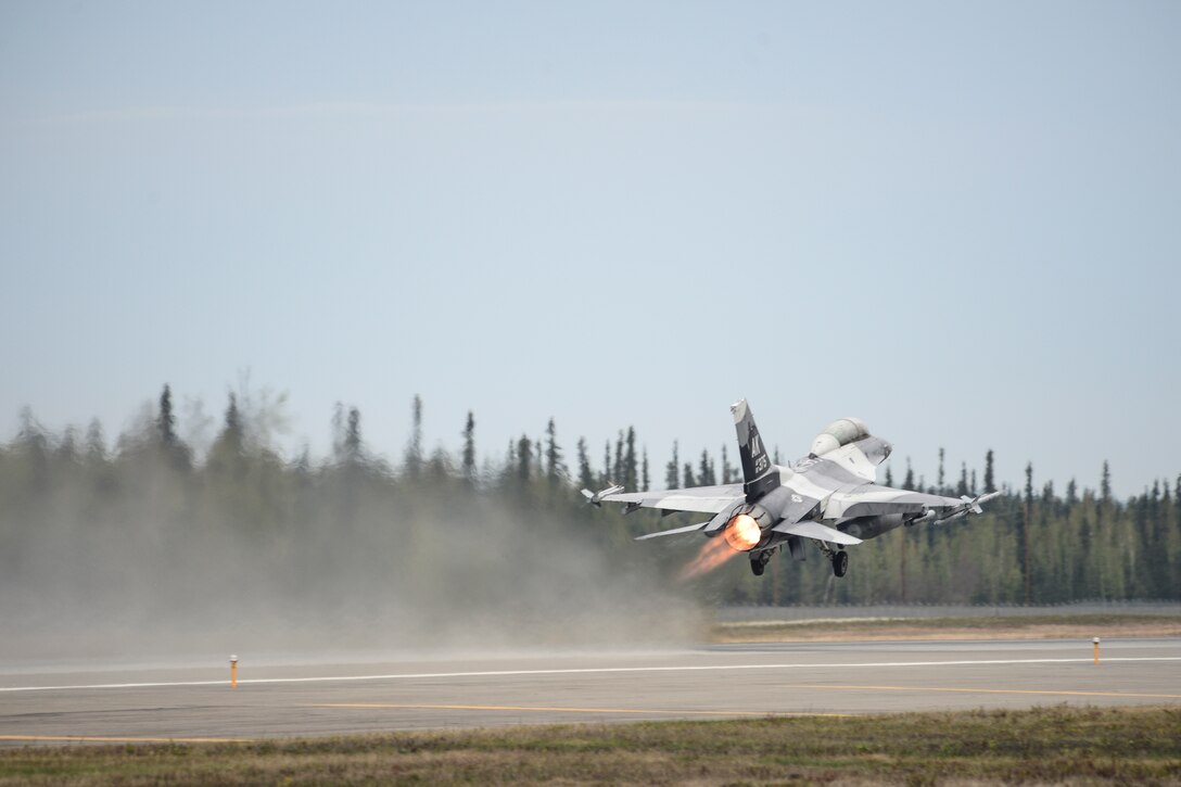 An F-16 Fighting Falcon assigned to the 18th Aggressor Squadron takes off during Red Flag Alaska 14, May 13, 2014, at Eielson Air Force Base, Alaska. The 18th AGRS tests visiting units' combat capability by acting as an enemy force throughout the exercise. (U.S. Air Force photo/Senior Airman Peter Reft)