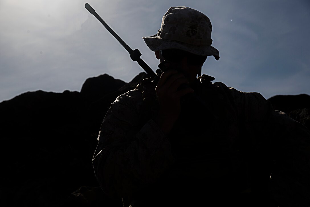 Major Jason Edholm, the air officer for 11th Marine Regiment based out of Marine Corps Base Camp Pendleton, Calif., and a San Diego native, communicates an airstrike with United Kingdom Army AH-64 Apache helicopter pilots at the Barry M. Goldwater Range, located in Southern Arizona, May 4. The airstrike was part of the United Kingdom’s Crimson Eagle training exercise.