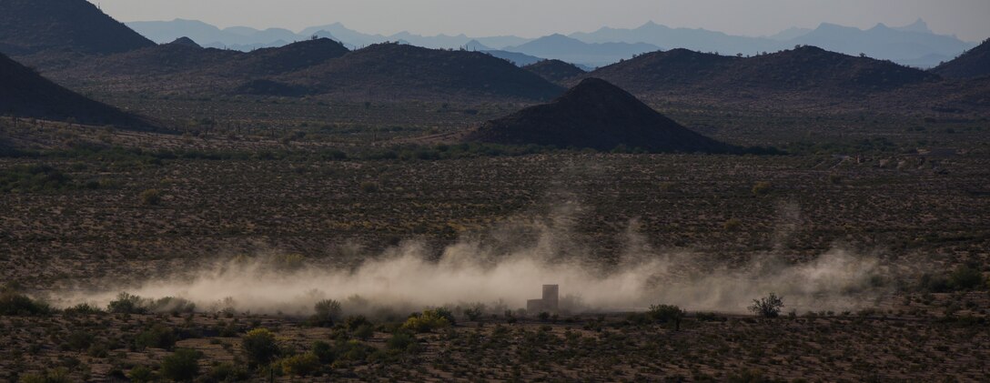 A United Kingdom Army AH-64 Apache helicopter destroys its target point with CRV7 rockets and gunfire at the Barry M. Goldwater Range, located in Southern Arizona, in part of the UK’s Crimson Eagle training exercise, May 3.  