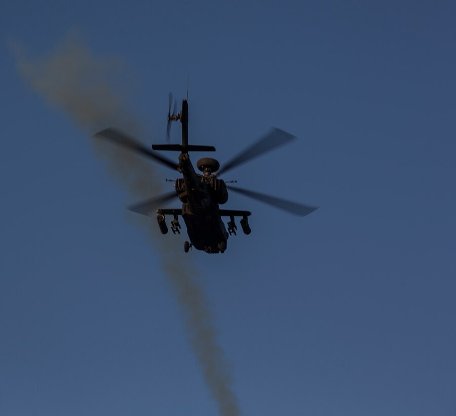 A United Kingdom Army AH-64 Apache helicopter destroys its target point with CRV7 rockets and gunfire at the Barry M. Goldwater Range, located in Southern Arizona, in part of the UK’s Crimson Eagle training exercise, May 3.  