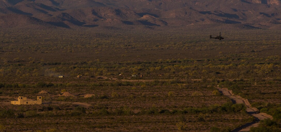 A United Kingdom Army AH-64 Apache helicopter destroys its target point with CRV7 rockets and gunfire at the Barry M. Goldwater Range, located in Southern Arizona, in part of the UK’s Crimson Eagle training exercise, May 3.  