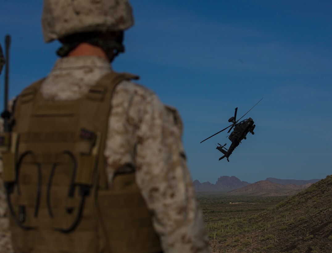 A United Kingdom Army AH-64 Apache helicopter soars over the Barry M. Goldwater Range, located in Southern Arizona, after providing close air support as part of the UK’s Crimson Eagle exercise, May 4.