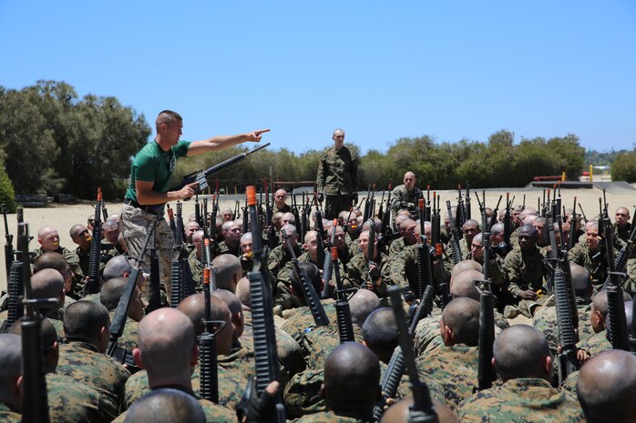 Sgt. Brian W. Hayes, Marine Corps Martial Arts Program instructor, teaches Company I, 3rd Recruit Training Battalion, how to perform bayonet techniques during a MCMAP class aboard Marine Corps Recruit Depot San Diego Calif., May 14. As recruits progress through their training, they will learn hand-to-hand combat techniques and warrior ethos.