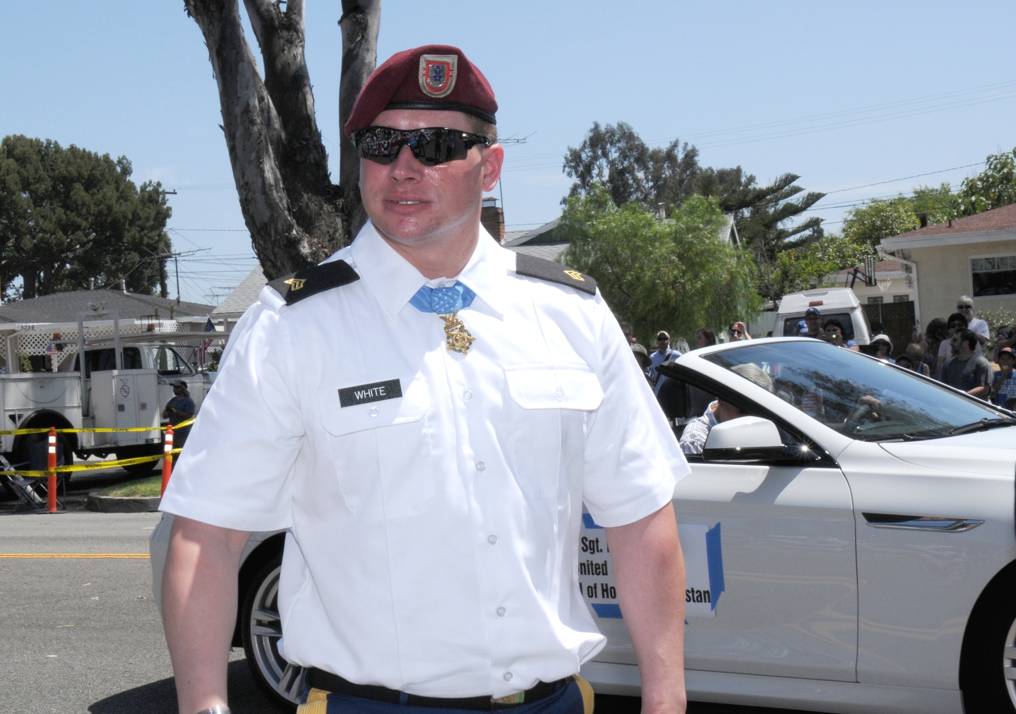 Former Army Sgt. Kyle White, a Medal of Honor recipient, walks towards the reviewing stand after exiting a convertible during the annual Torrance Armed Forces Day parade, May 17. Only the seventh living recipient of the medal, he was honored May 13 at a White House ceremony for saving the lives of soldiers in his unit during combat in Afghanistan. (Photo by Joe Juarez)