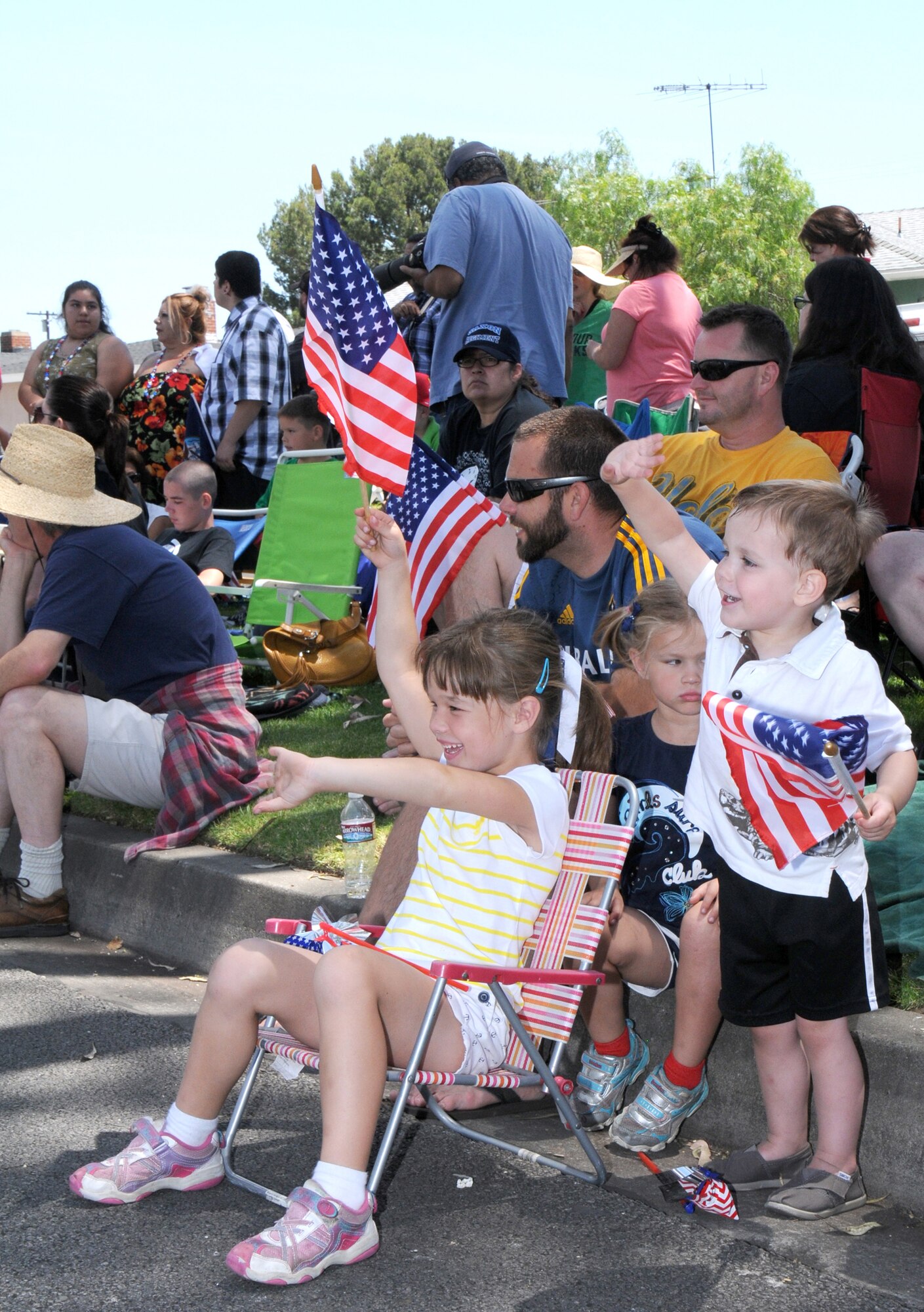 Spectators show their patriotic spirit during the annual Torrance Armed Forces Day parade, May 17. (Photo by Joe Juarez) 