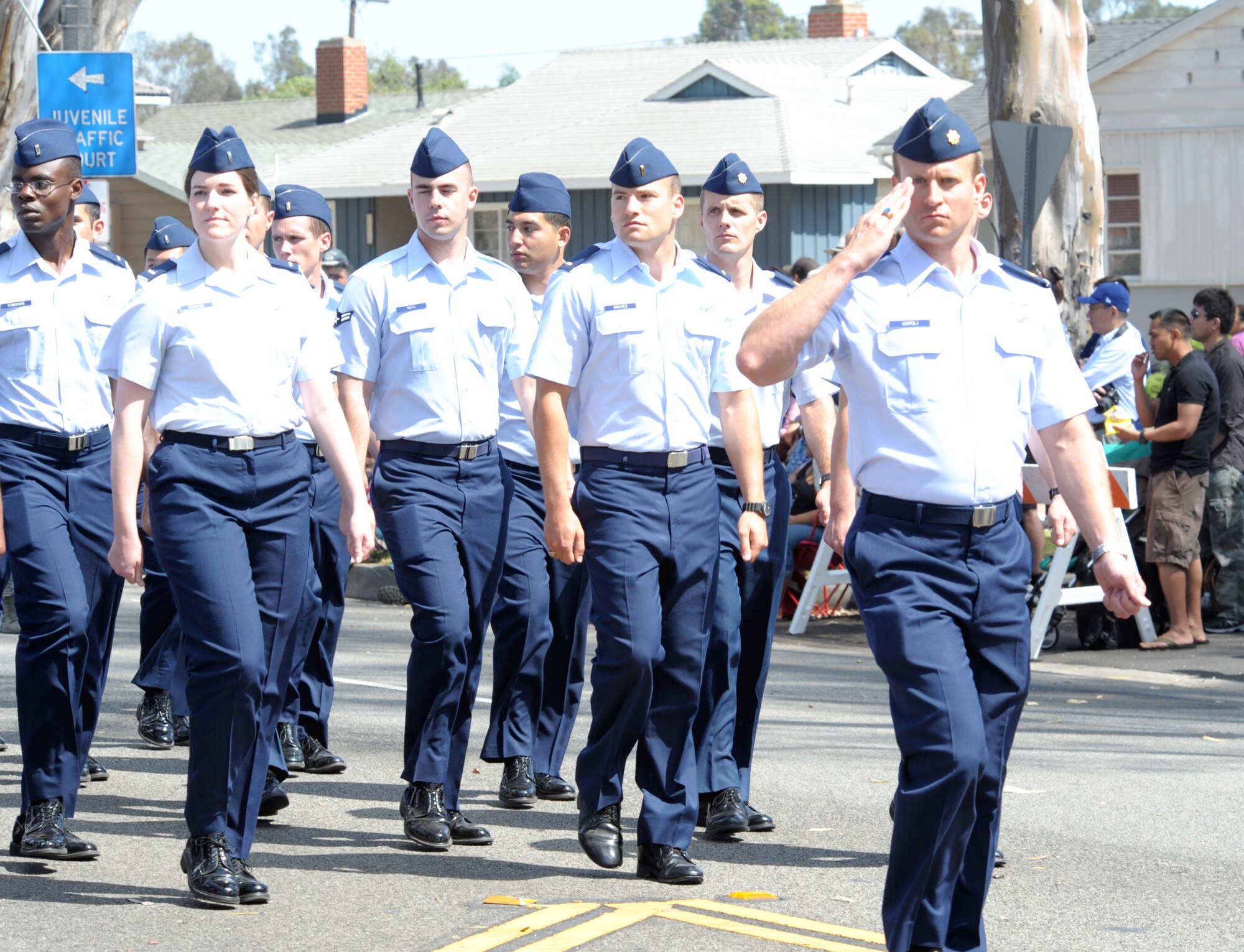 A marching unit from Los Angeles Air Force Base salutes the reviewing stand during the annual Torrance Armed Forces Day parade, May 17. (Photo by Joe Juarez) 