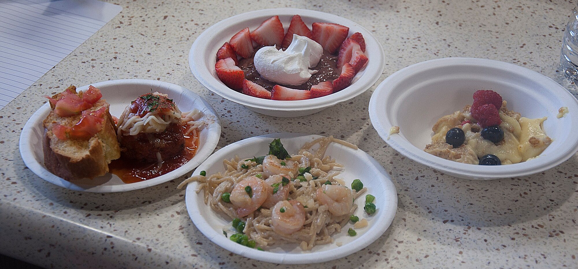 140521-F-GZ967-074 The completed dishes sit before the judges chairs May 21 during a youth center cooking competition in the Fall Hall Community Center. The two competing teams had to not only cook the dish but present the dish to the judges. (U.S. Air Force photo by Airman 1st Class Brandon Valle)