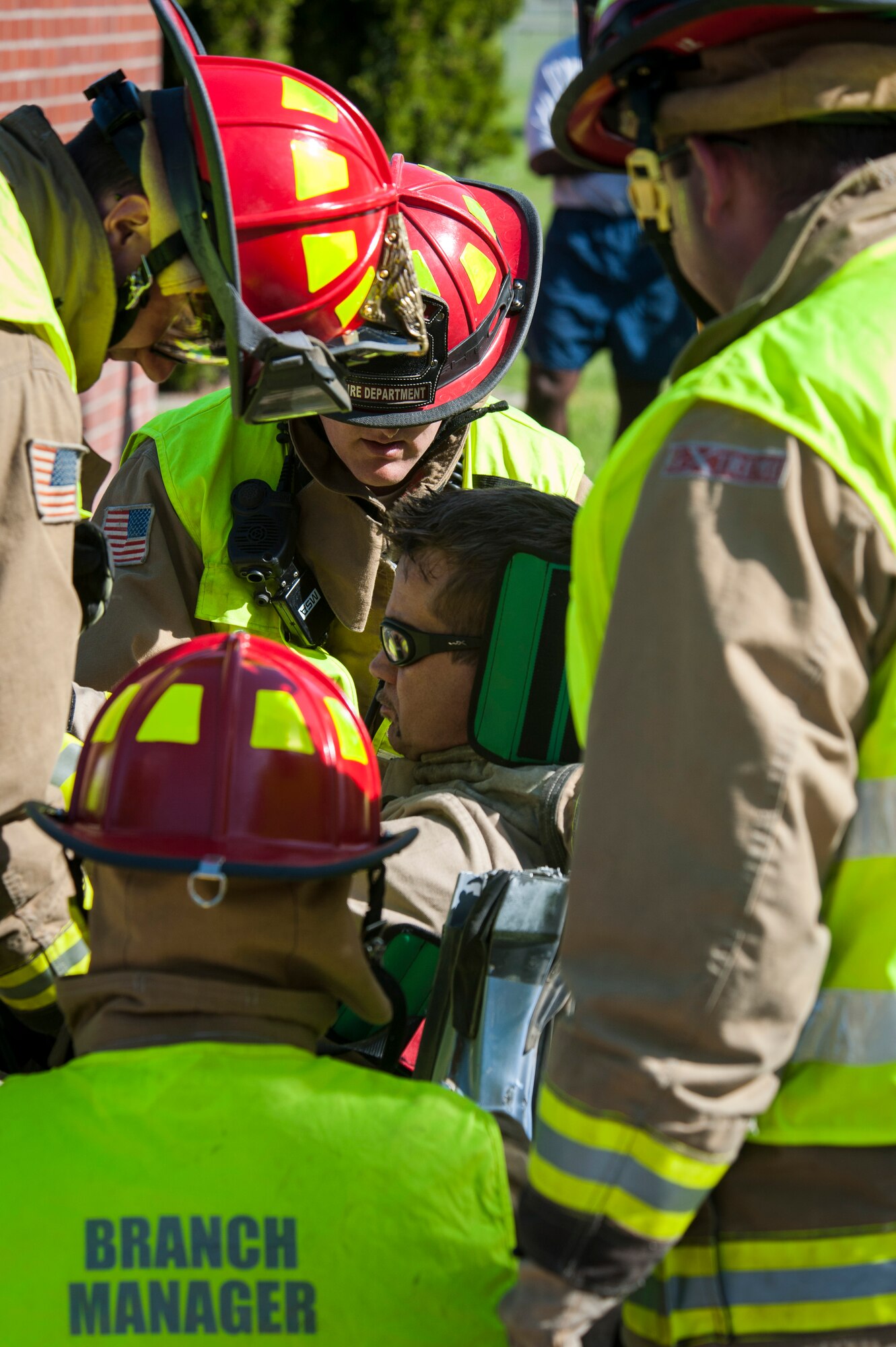 Fairchild Firefighters demonstrate how to operate the "Jaws of Life" extraction tool during the Critical Days of Summer kickoff event at Fairchild Air Force Base, Wash., May 22, 2014. This year's CDS theme is "Risk: Double Checks; Not Second Thoughts," calling for family, friends and coworkers to act as the final barrier between a good time and a life-impacting disaster. (U.S. Air Force photo by Staff Sgt. Benjamin W. Stratton/Released)