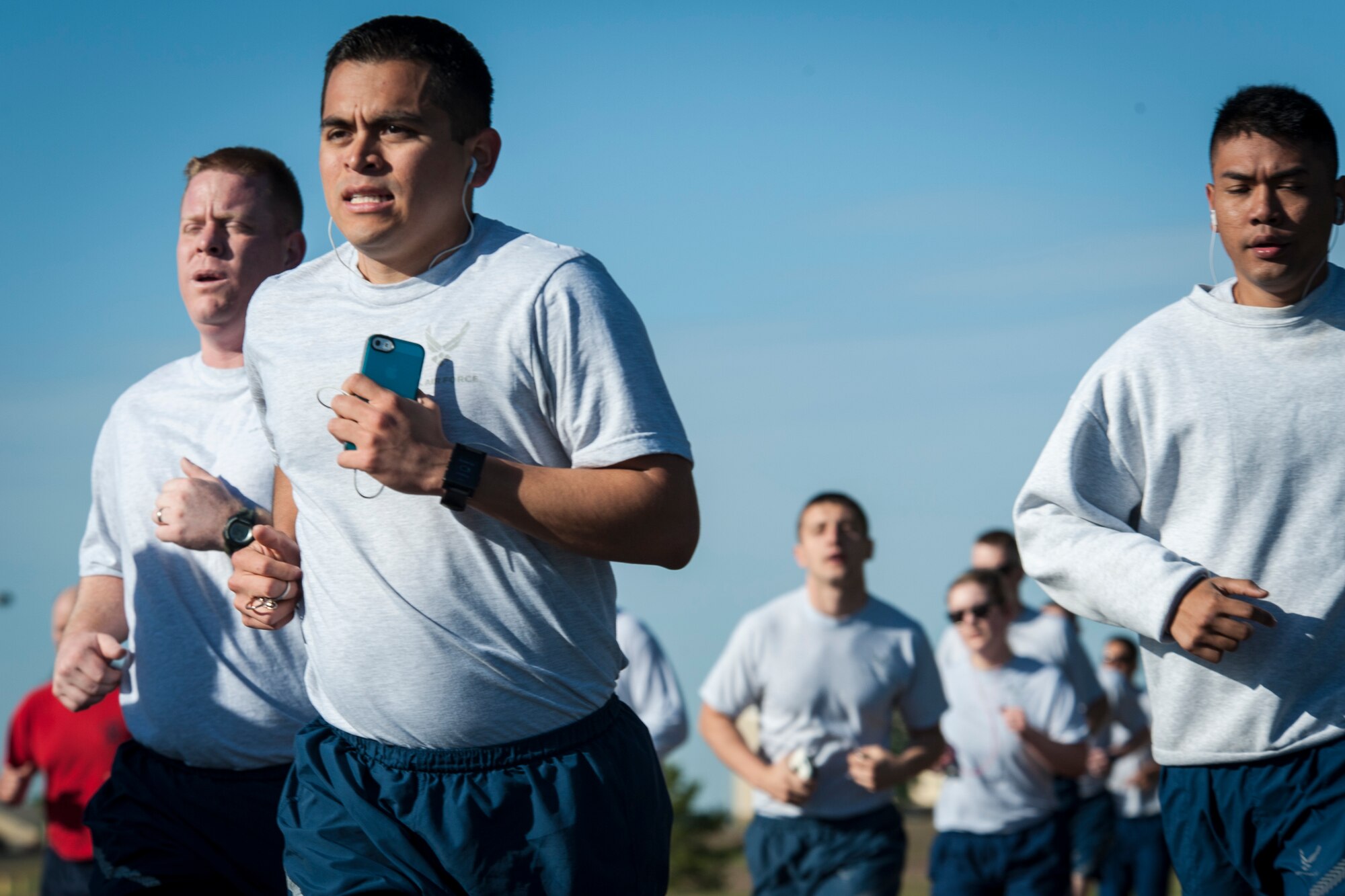 Airmen participating in the wing run race for the finish line during the Critical Days of Summer kickoff event at Fairchild Air Force Base, Wash., May 22, 2014. This year's CDS theme is "Risk: Double Checks; Not Second Thoughts," calling for family, friends and coworkers to act as the final barrier between a good time and a life-impacting disaster. (U.S. Air Force photo by Staff Sgt. Benjamin W. Stratton/Released)