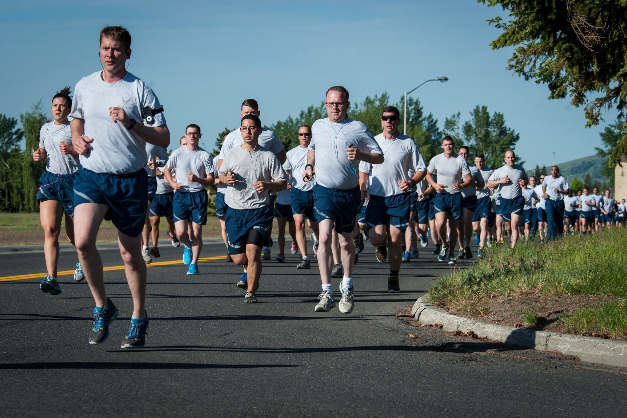 Airmen participating in the wing run race for the finish line during the Critical Days of Summer kickoff event at Fairchild Air Force Base, Wash., May 22, 2014. This year's CDS theme is "Risk: Double Checks; Not Second Thoughts," calling for family, friends and coworkers to act as the final barrier between a good time and a life-impacting disaster. (U.S. Air Force photo by Staff Sgt. Benjamin W. Stratton/Released)