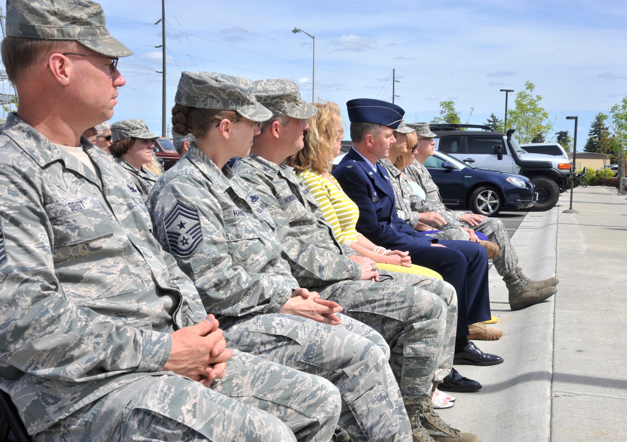Leadership from Team Fairchild look on as the ribbon cutting ceremony signals the official opening of the new 336th Training Group headquarters building at Fairchild Air Force Base, Wash., May 21, 2014. Leadership and community members involved in the project were in attendance and recieved a tour of the new building following the ceremony. (U.S. Air Force photo by Senior Airman Mary O'Dell/Released)