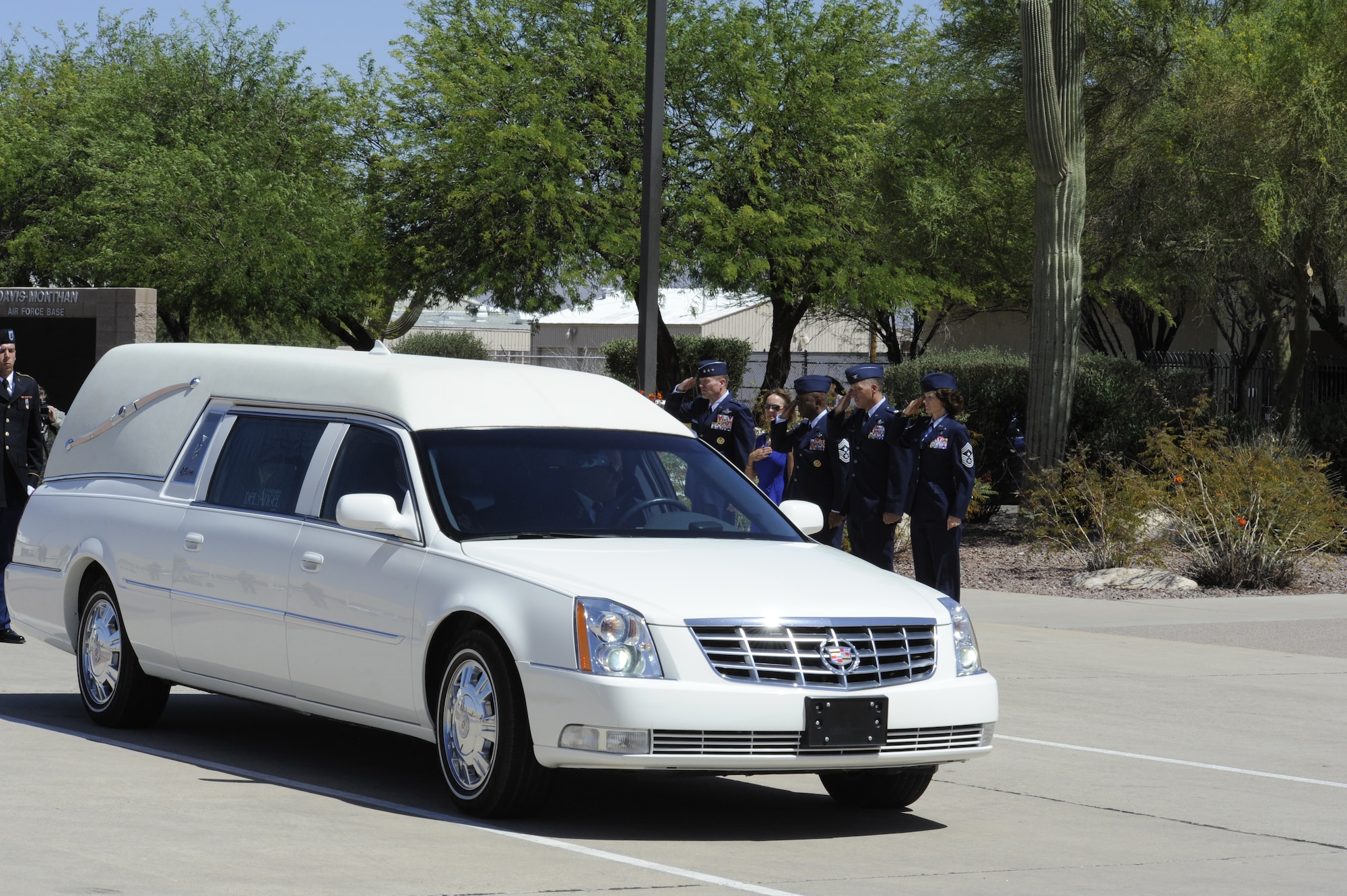 Twelfth Air Force, Air Forces Southern, leadership and 355th Fighter Wing leadership render salute to the remains of U.S. Army Command Sergeant Major Martin Barreras at Davis-Monthan Air Force Base, Ariz., May 22, 2014. Barreras’ remains were transported to Tucson, his hometown, from an Antonio Military Medical Center, Joint Base San Antonio, Texas, after succumbing to injures he sustain on May 6, in Harat Province, Afghanistan, when enemy forces attacked his unit with small arms fire. (U.S. Air Force photo by Airman 1st Class Betty R. Chevalier/Released)