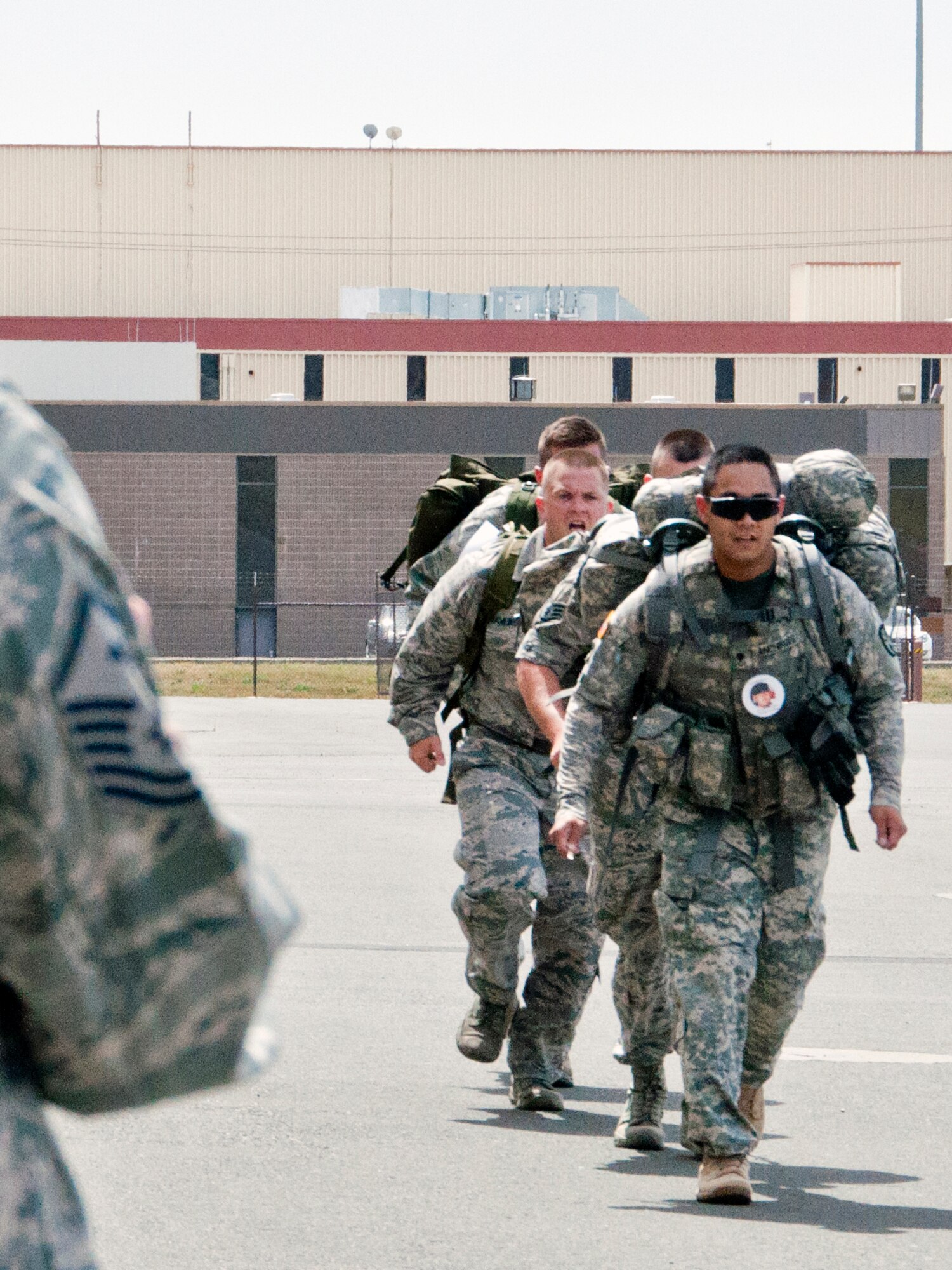 TheTravis first sergeants greet competitors at the finish line of the fourth annual Gold Star Ruck March May 17 on Travis. (U.S. Air Force photo/Senior Airman Madelyn Brown)