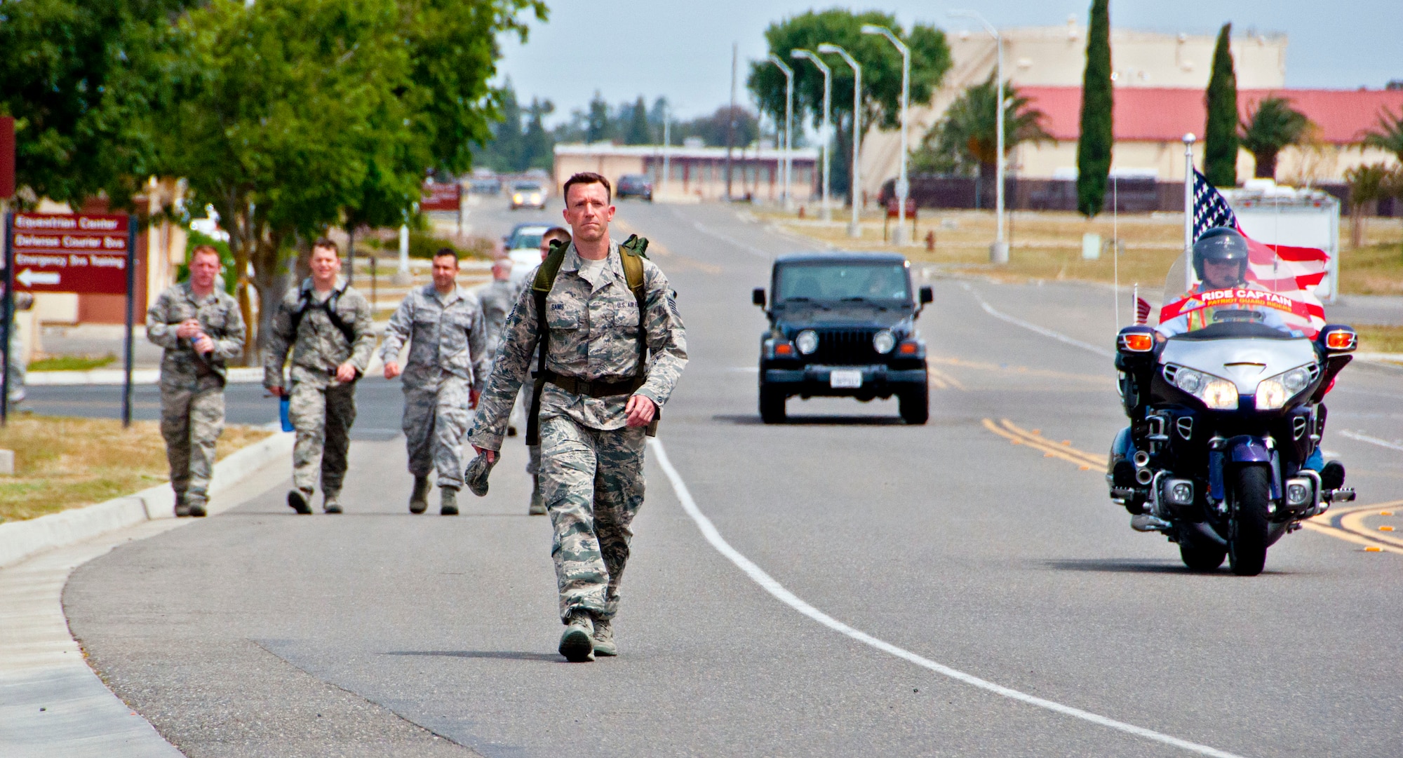Tech. Sgt. Nathan Sams, 60th Communications Squadron, completes the final stretch of the ruck march with his 30-pound ruck sack to honor the family members of fallen service members May 17 during the fourth annual Gold Star Ruck March. (U.S. Air Force photo/Senior Airman Madelyn Brown).