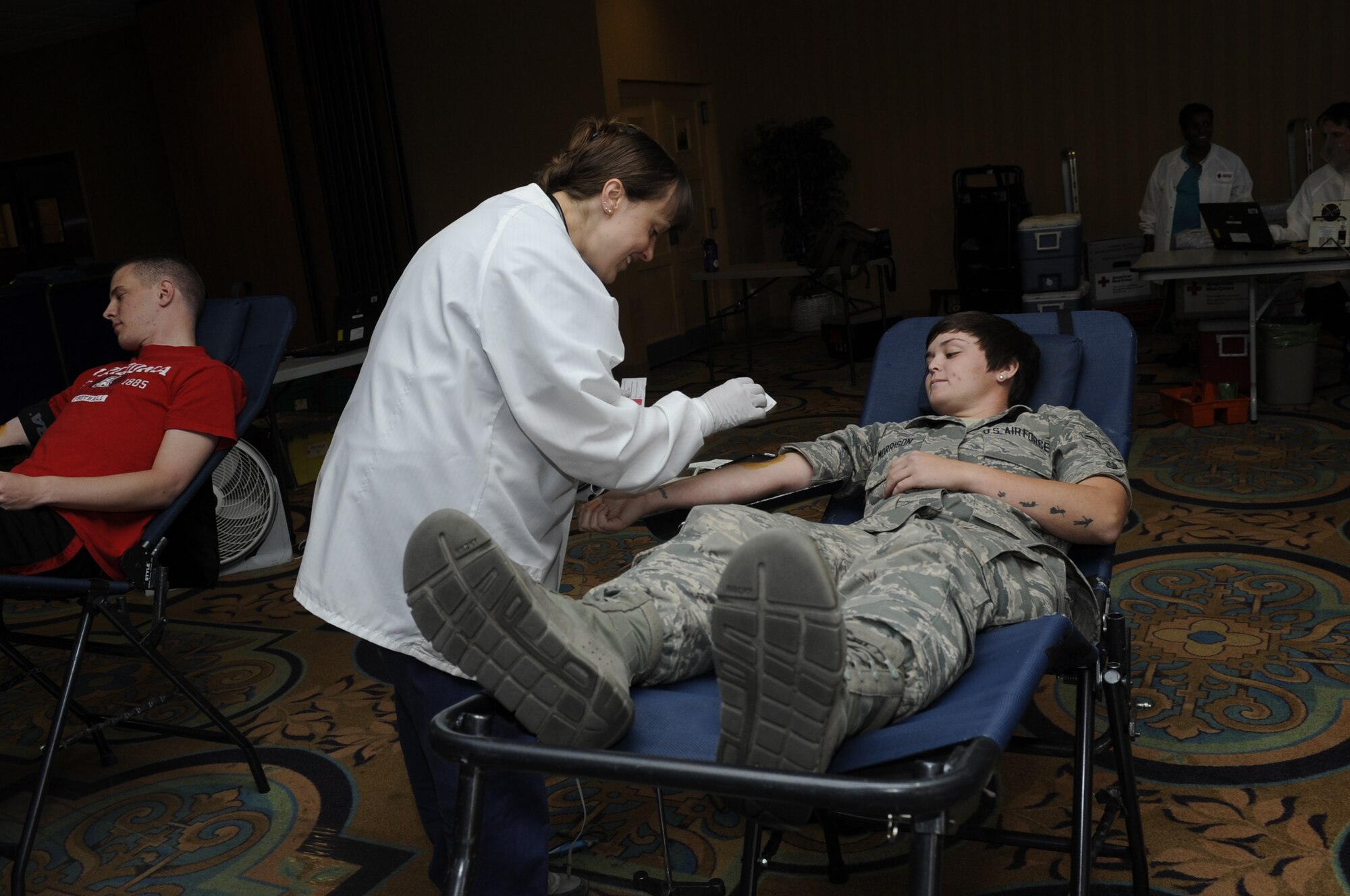 U.S. Air Force Airman Samantha Morrison gives blood during a blood drive at Davis-Monthan Air Force Base, Ariz., May 21, 2014. D-M hosts a blood drive at least once every other month with a goal to collect 100 pints of blood. (U.S. Air Force photo by Airman 1st Class Betty R. Chevalier/Released)