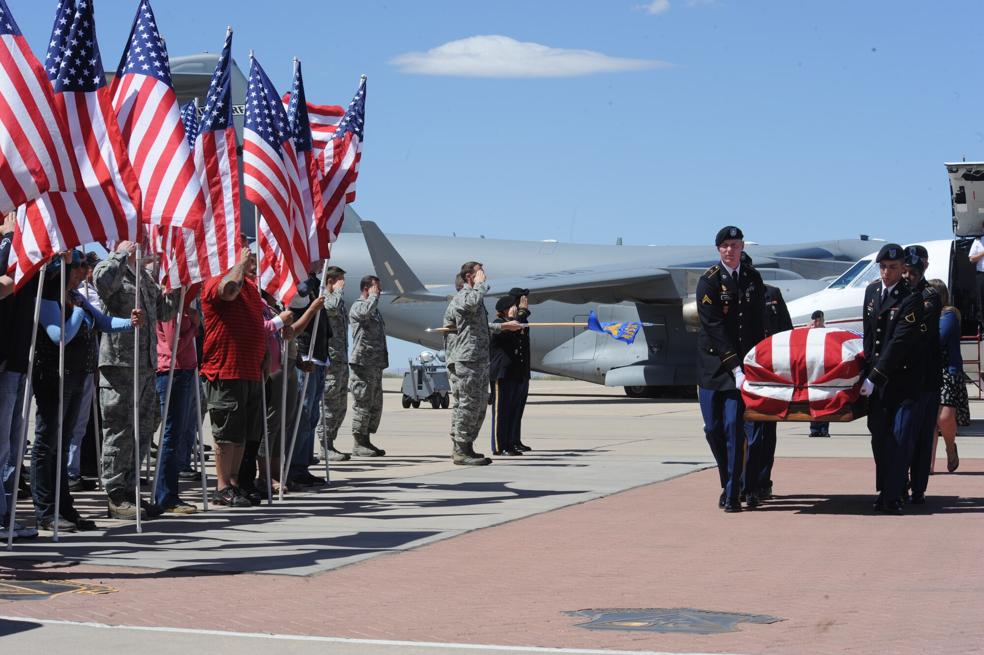 U.S. Army Fort Huachuca Select Honor Guard carries the remains of Command Sgt. Maj. Martin Barreras at Davis-Monthan Air Force Base, Ariz., May 22, 2014. Barreras, a highly decorated Ranger, was the top senior enlisted soldier for the 2nd Battalion, 5th Infantry Regiment, 3rd Brigade Combat Team, 1st Armored Division since March 2013. (U.S. Air Force photo by Senior Airman Sivan Veazie/Released)