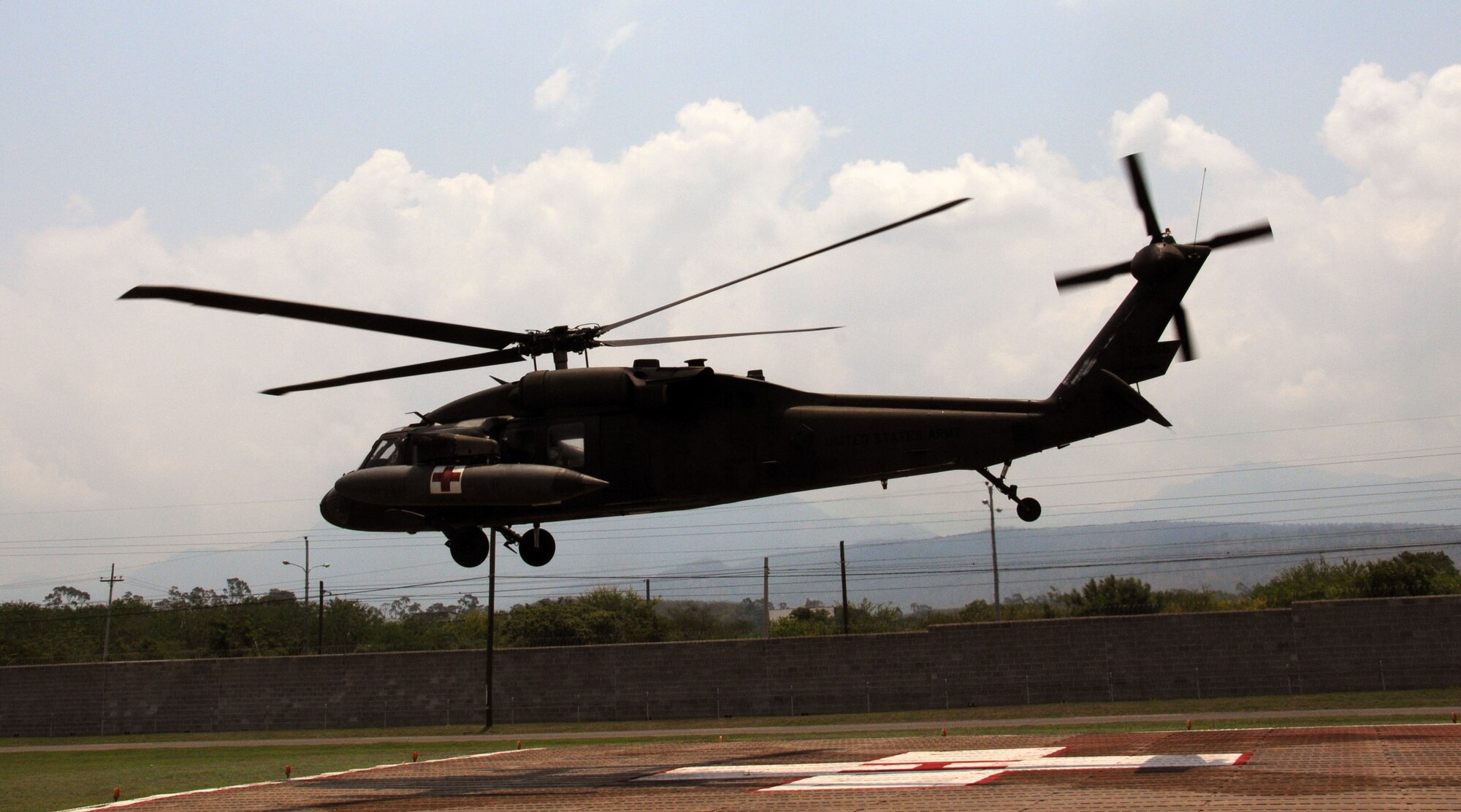A U. S. Army UH-60 Blackhawk MEDEVAC helicopter takes off from the Joint Task Force- Bravo Medical Element's helicopter pad at Soto Cano Air Base to transport an automobile accident victim to the Hospital Militar in Tegucigalpa, Honduras, May 13, 2014, in response to a Honduran government request for a medical evacuation (MEDEVAC).  A vehicle traveling west on Honduras Highway CA-5 about 13 miles outside of Comayagua was struck from behind by a tractor trailer truck.  The 18-wheeler subsequently pushed the vehicle into the trailer of another tractor trailer crushing the vehicle.  (Photo by U. S. Air National Guard Capt. Steven Stubbs)