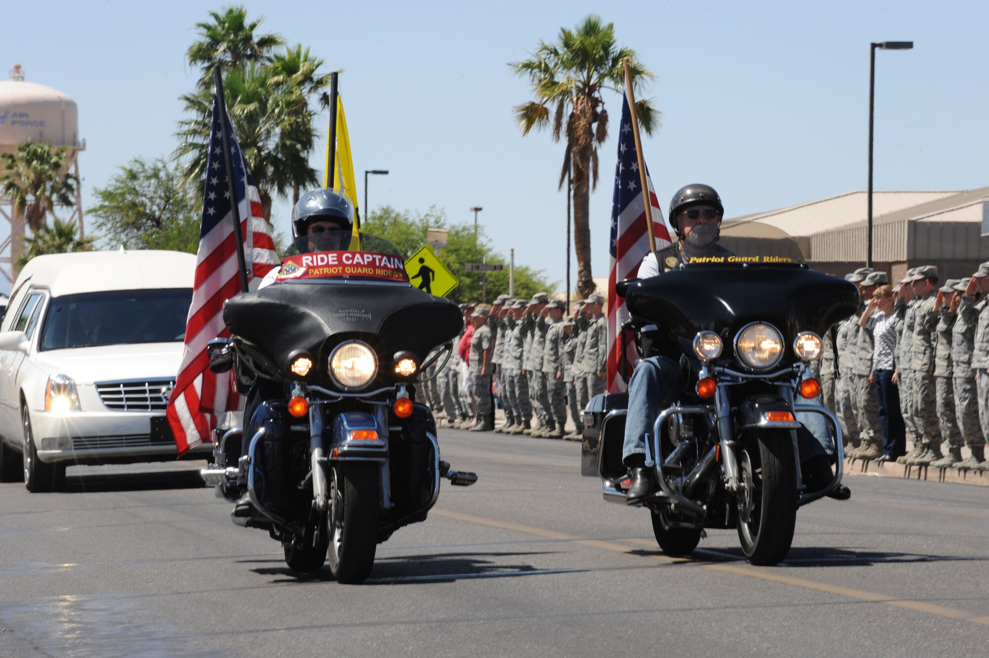 Patriot Guard Riders escort the procession of U.S. Army Command Sgt. Maj. Martin R. Barreras Davis-Monthan Air Force Base, Ariz., May 22, 2014. Vehicles from several local law enforcement agencies as well as the PGR lead the procession from the flight line at D-M to a funeral home in Tucson. (U.S. Air Force photo by Airman 1st Class Cheyenne Morigeau/Released)