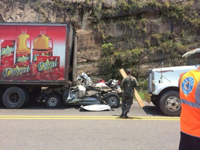 A vehicle traveling west on Honduras Highway CA-5 about 13 miles outside of Comayagua, Honduras was struck from behind by a tractor trailer truck, May 13, 2014.  The 18-wheeler subsequently pushed the vehicle into the trailer of another tractor trailer crushing the vehicle.  Joint Task Force-Bravo’s Medical Element (MEDEL) and 1-228th Aviation Regiment responded to a Honduran government request for a ground and air medical evacuation (MEDEVAC) of an automobile accident victim to the Hospital Militar in Tegucigalpa, Honduras.  (Courtesy Photo)