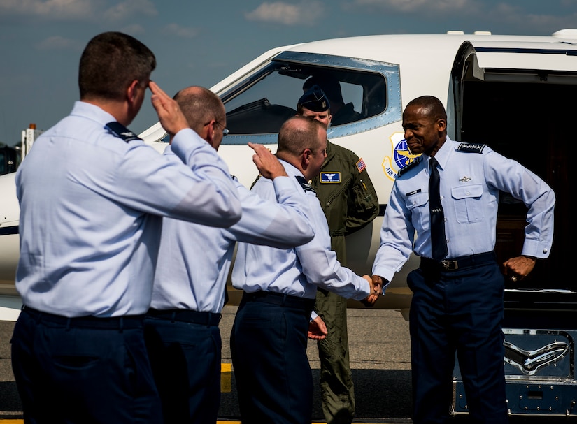 Gen. DarrenMcDew, Air Mobility Command commander, is greeted by Joint Base Charleston leadership, May 21, 2014, at JB Charleston, S.C. McDew visited JB Charleston where he attended the 437th Airlift Wing change of command, held an ‘All-Call’ and officiated Col. Darren Hartford’s promotion to brigadier general. (U.S. Air Force photo/ Senior Airman Dennis Sloan)