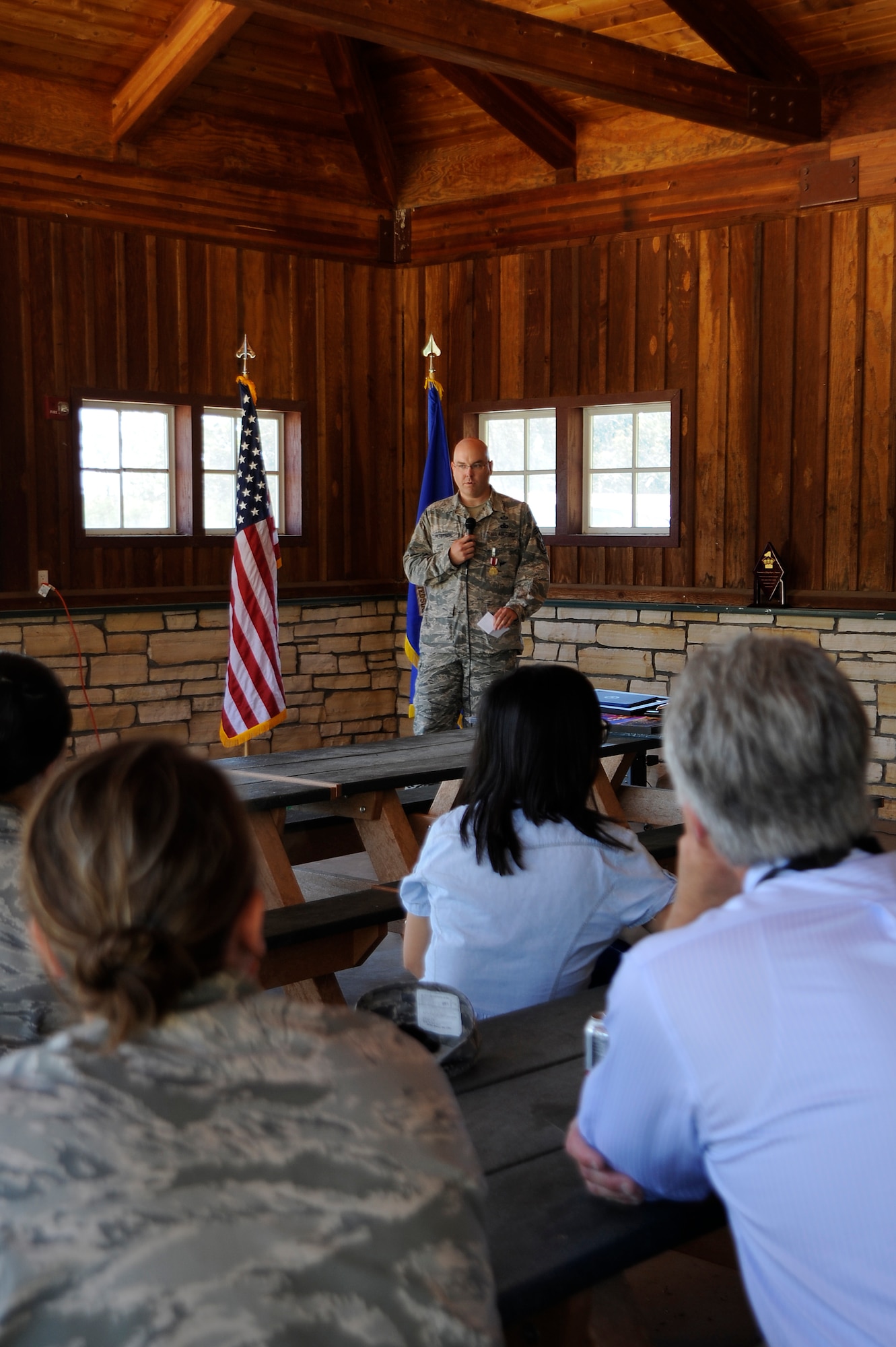 Chief Master Sgt. Ryan Peterson, 30th Space Wing command chief, addresses a crowd of Team V members during his going-away event at Cocheo Park May 12. Base senior leaders and more than 50 members of Team V gathered at Cocheo Park to honor the 30th Space Wing's most senior enlisted member. Peterson will be stepping-down moving-on to be the command chief at Davis-Monthan Air Force Base, Arizona, at the end of May.(U.S. Air Force photo by/Staff Sgt. Erica Picariello)
