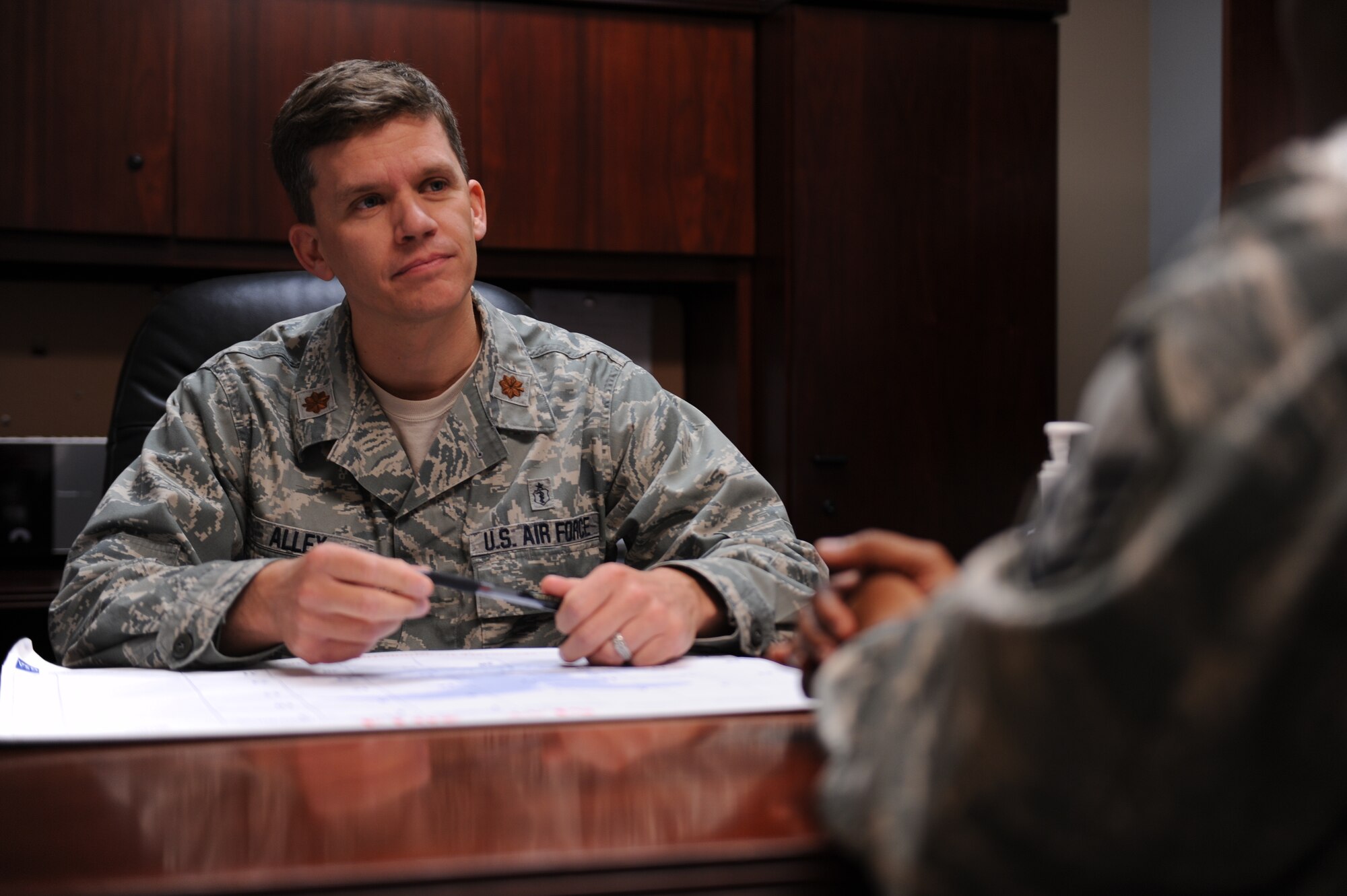 Major Ebon Alley, 19th Medical Operations Squadron flight commander, listens as an Airman conveys stressors that have led them to the mental health clinic May 21, 2014, at Little Rock Air Force Base, Ark. When it comes to mental health, knowing your wingman and intervening when you see something negative or inappropriate is crucial. (U.S. Air Force photo by Airman 1st Cliffton Dolezal)