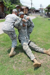 Joint Task Force-Bravo members during the hands-on training portion of the combat life saver course taught by members of the Medical Element. Joint Task Force-Bravo’s Medical Element instructed 23 individuals on combat life saver techniques and tactical casualty combat care from May 12-16, 2014. This 40 hour course trains non-medical servicemembers on the ability to provide advanced first aid and life saving procedures beyond the level of self-aid. (Courtesy photo)