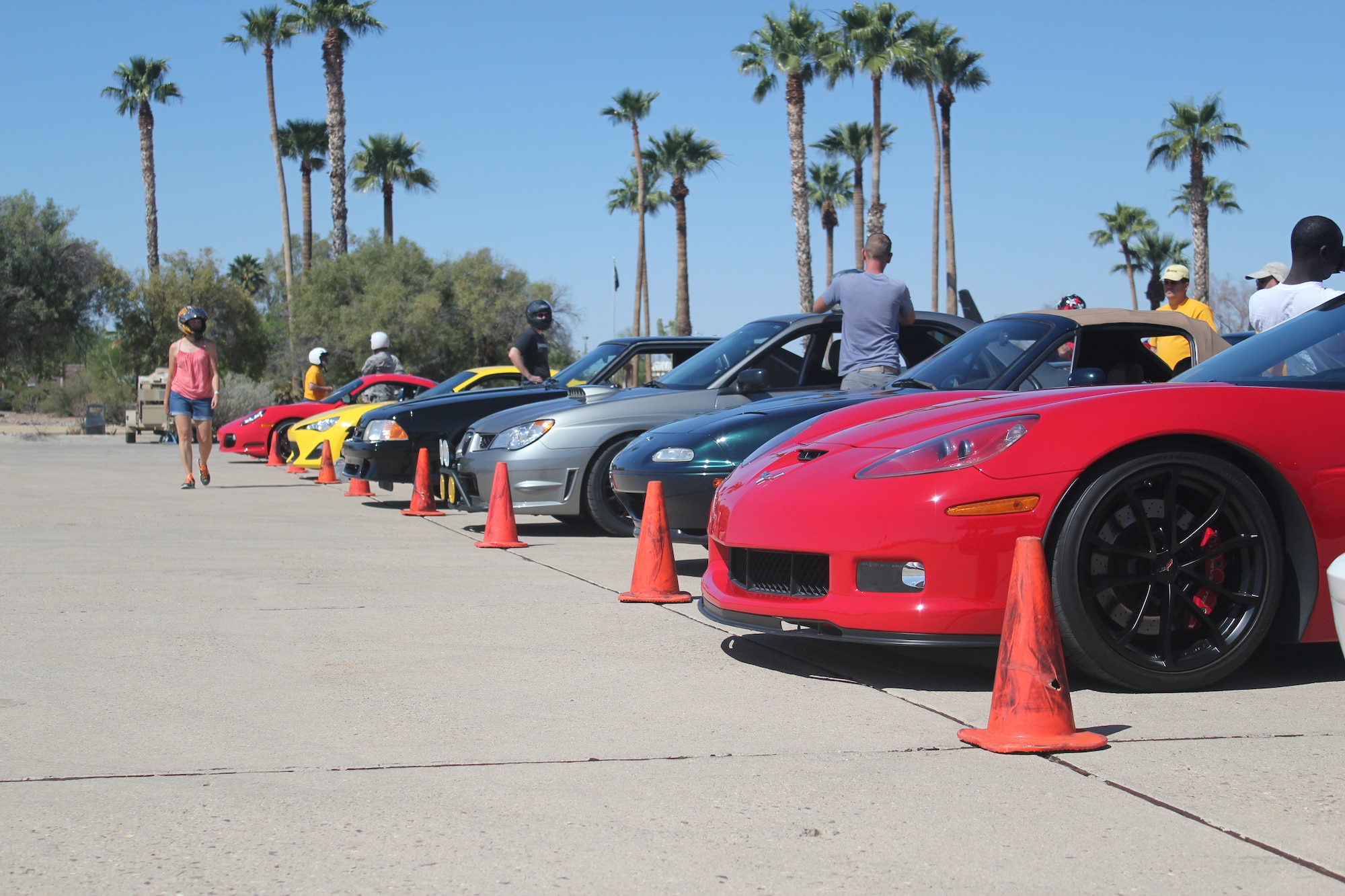 Cars line up in preparation for The Sports Car Club of America autocross event at Davis-Monthan Ariz., May 10, 2014. This event gave Desert Lightning Team members the opportunity to test the limits of their vehicles while maneuvering through a controlled course. (U.S. Air Force photo by Staff Sgt. Jody Ouch/Released) 